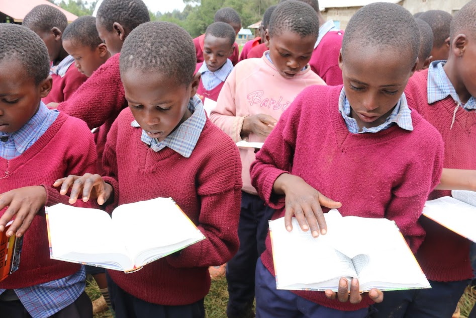 Displaying MEKARO PS PUPILS READING THE BIBLE.JPG